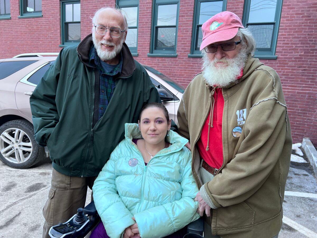 Dwight Devork (L), Aja Devork, and Jim Rouillard appear outside the town hall after voting in the primary election in Wolfeboro, N.H., on Jan. 23, 2024. (Lawrence Wilson/The Epoch Times)