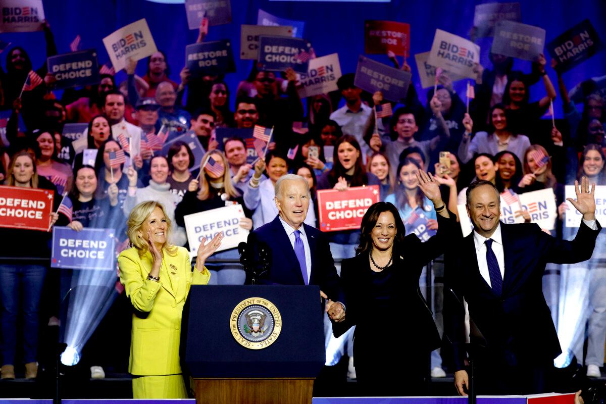 L-R) First lady Jilly biden, President Joe Biden, Vice President Kamala Harris and Second gentleman Douglas Emhoff join hands as they depart a ”Reproductive Freedom Campaign Rally" at George Mason University on Jan. 23, 2024 in Manassas, Virginia. (Anna Moneymaker/Getty Images)