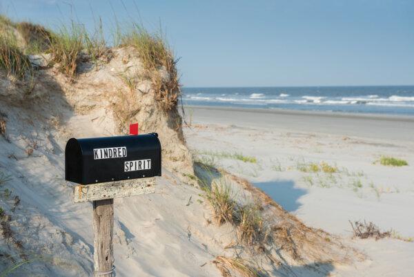The Kindred Spirit Mailbox on Bird Island near Sunset Beach is an iconic symbol of Brunswick Islands. The mailbox contains journals where visitors can write their innermost thoughts for others to read. (Visit NC/TNS)