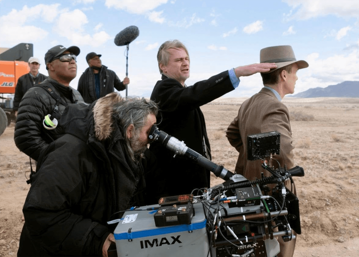 Director Christopher Nolan (standing center) shot “Oppenheimer” entirely on film, much of it utilizing high-resolution IMAX cameras. (Universal Pictures)