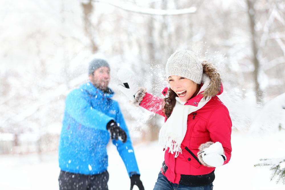 The winter air can quickly be filled with the joyful shouts of a snowball fight. (Maridav/Shutterstock)
