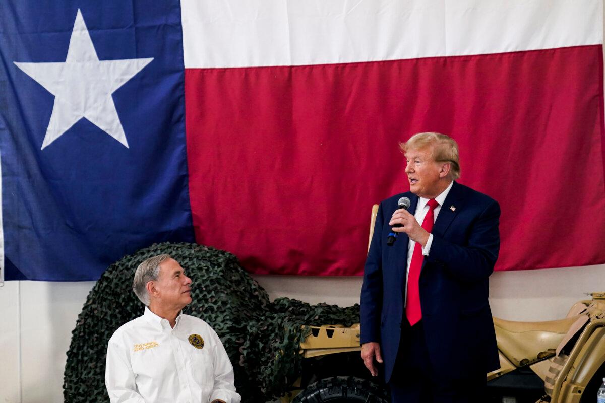 Texas Gov. Greg Abbott, left, listens as former President Donald Trump, right, speaks in Edinburg, Texas, on Nov. 19, 2023 (AP Photo/Eric Gay)