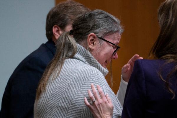 Jennifer Crumbley becomes emotional after seeing video of her son walking through Oxford High School during shooting rampage in the courtroom of Oakland County Judge Cheryl Matthews in Pontiac, Mich., on Jan. 25, 2024. (Mandi Wright/Pool/Detroit Free Press via AP)