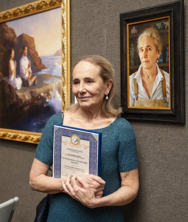 Alessandra Marrucchi, outstanding technique award recipient, stands next to her painting “A Self Portrait With a Pearl Earring” at "The Sixth NTD International Figure Painting Competition" on Jan. 18, 2024, at the Salmagundi Club in New York City. (Samira Bouaou/The Epoch Times)