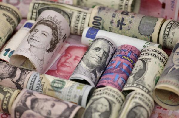 Euro, Hong Kong dollar, U.S. dollar, Japanese yen, British pound, and Chinese 100-yuan banknotes are seen in a picture illustration shot on Jan. 21, 2016. (Jason Lee/Reuters)