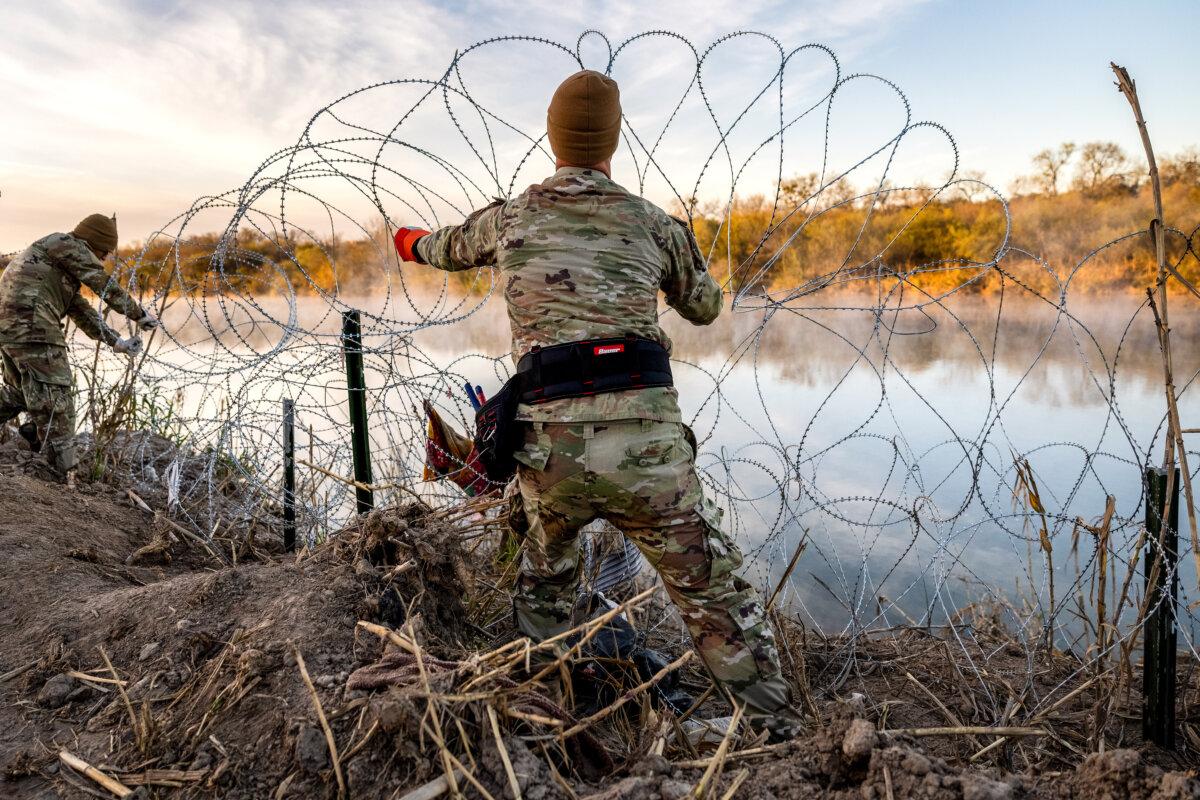 Texas National Guard soldiers install additional razor wire along the Rio Grande in Eagle Pass, Texas, on Jan. 10, 2024. (John Moore/Getty Images)