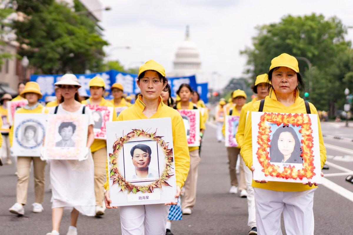 Falun Gong practitioners take part in a parade to mark the 24th anniversary of the persecution of the spiritual discipline in China by the Chinese Communist Party in Washington on July 20, 2023. The pictures they are holding are of those who have been persecuted to death. (Samira Bouaou/The Epoch Times)
