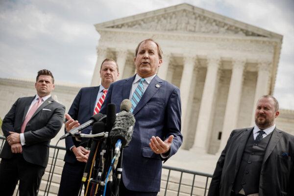 Texas Attorney General Ken Paxton (C) talks to reporters in front of the Supreme Court in Washington, on April 26, 2022. (Chip Somodevilla/Getty Images)