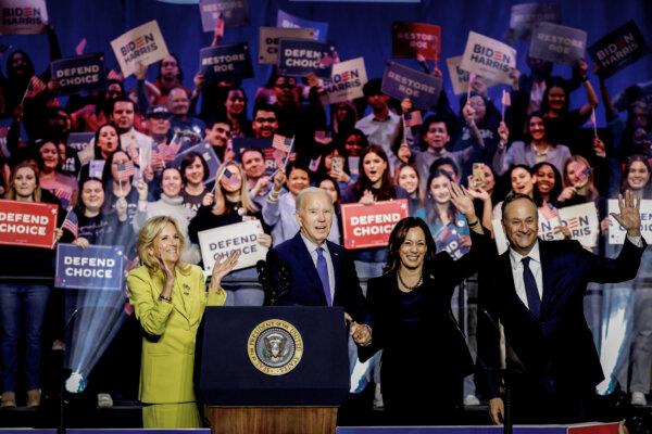 (L-R) First Lady Jill Biden, President Joe Biden, Vice President Kamala Harris, and Second Gentleman Douglas Emhoff join hands at a ”Reproductive Freedom Campaign Rally" at George Mason University on Jan. 23, 2024, in Manassas, Va. (Anna Moneymaker/Getty Images)