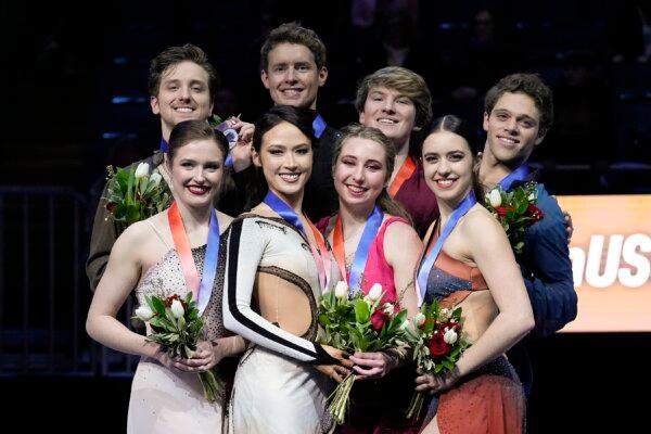 Silver medalists Christina Carreira and Anthony Ponomarenko (L to R), gold medalists Madison Chock and Evan Bates, bronze medalists Emily Bratti and lan Somerville, and pewter medalists Caroline Green and Michael Parsons participate in a medal ceremony for championship ice dance at the U.S. figure skating championships Saturday, Jan. in Columbus, Ohio, on Jan. 27, 2024. (Sue Ogrocki/AP Photo)