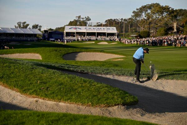 Matthieu Pavon of France plays his shot from the bunker on the 18th hole during the final round of the Farmers Insurance Open at Torrey Pines South Course in La Jolla, Calif., on Jan. 27, 2024. (Orlando Ramirez/Getty Images)