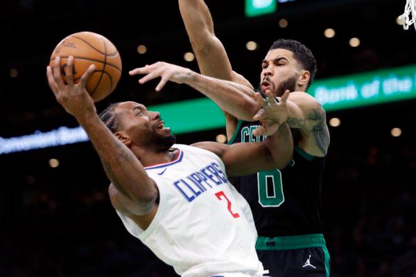Los Angeles Clippers' Kawhi Leonard (2) shoots against Boston Celtics' Jayson Tatum (0) during the first half of an NBA basketball game in Boston on Jan. 27, 2024. (Michael Dwyer/AP Photo)
