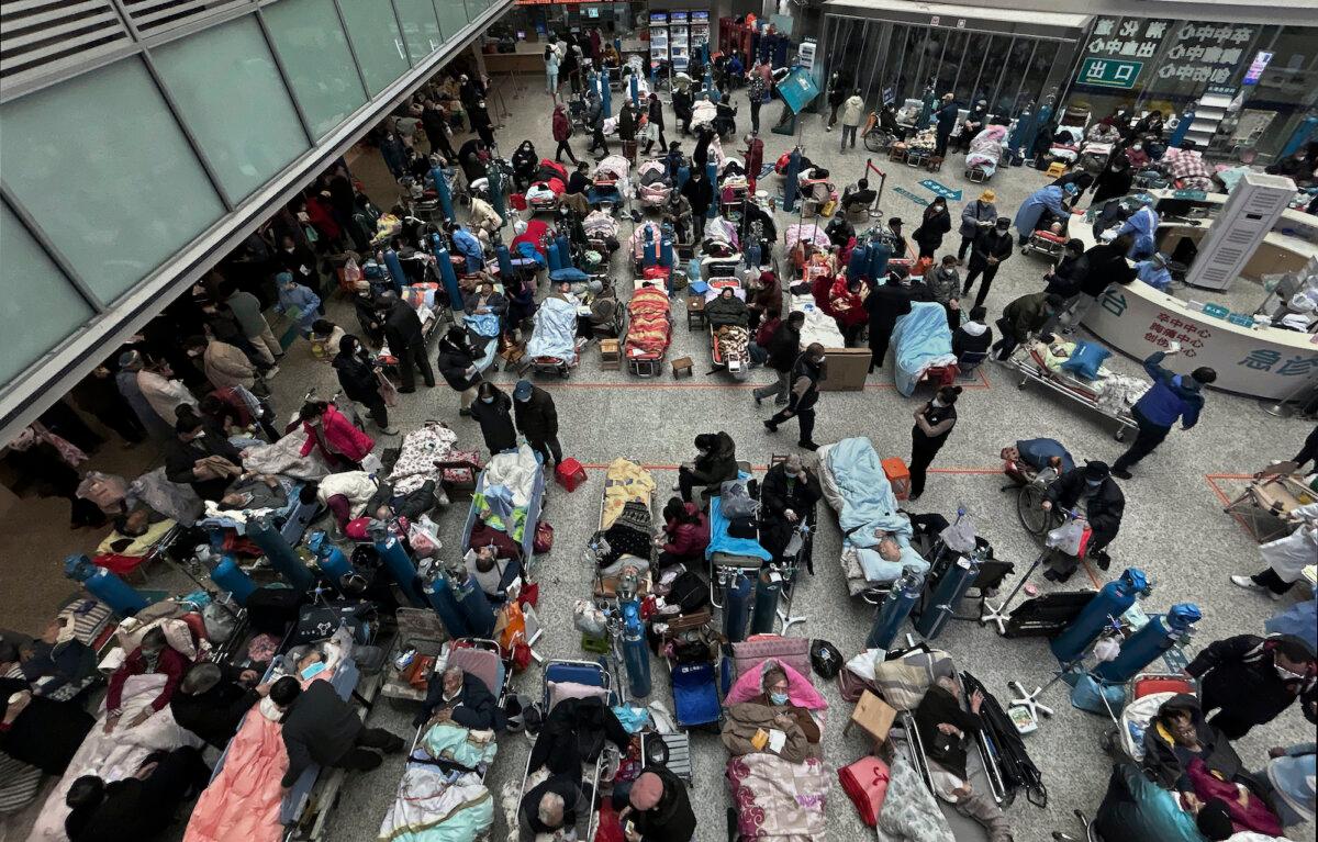 Patients on beds set up in the atrium area of a busy hospital in Shanghai on Jan. 13, 2023. (Kevin Frayer/Getty Images)