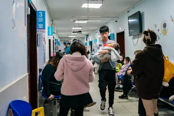 Parents with children suffering from respiratory diseases line up at a children's hospital in Chongqing, China, on Nov. 23, 2023. (CFOTO/Future Publishing via Getty Images)