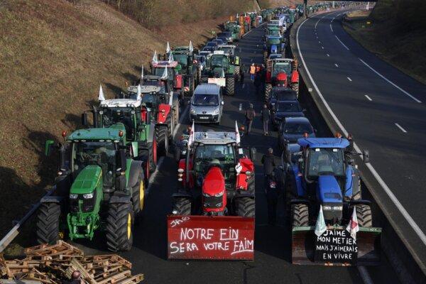 Tractors and other vehicles line up on the A16 highway as French farmers try to reach Paris during a protest over price pressures, taxes, and green regulation, grievances shared by farmers across Europe, in Beauvais, France, on Jan. 29, 2024. (Stephanie Lecocq/Reuters)