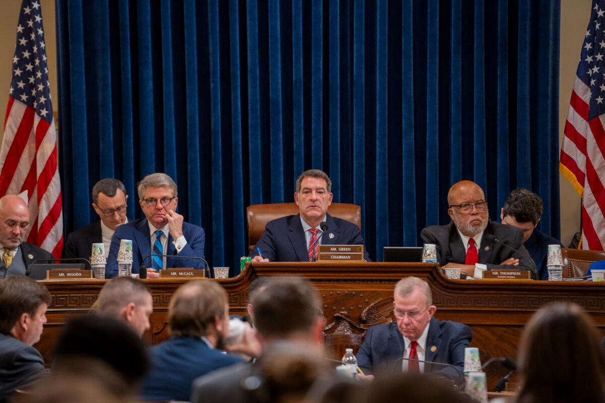 (L-R) Rep. Michael McCaul (R-Texas), Chairman of the House Committee on Homeland Security Rep. Mark Green (R-Tenn.), and Ranking Member Rep. Bennie Thompson (D-Miss.) meet with other lawmakers to mark up articles of impeachment against Secretary of the Department of Homeland Security (DHS) Alejandro N. Mayorkas in Washington on Jan. 30, 2024. (Madalina Vasiliu/The Epoch Times)