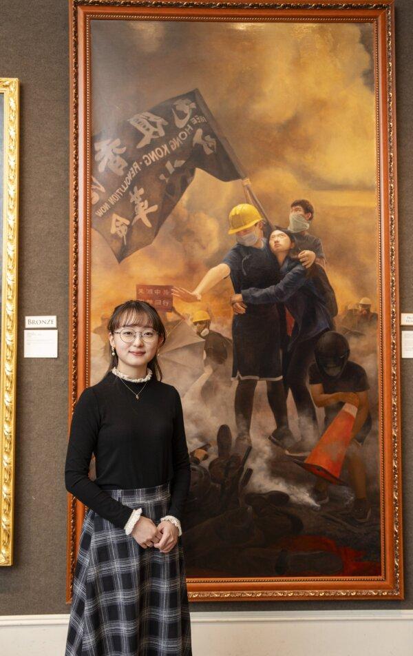 Shi-Ju Chiang, profound humanities award recipient, stands in front of her painting "Choosing Conscience Amid Political Unrest" at the Sixth NTD International Figure Painting Competition, at the Salmagundi Club in New York City, on Jan 18 2024. (Samira Bouaou/The Epoch Times)