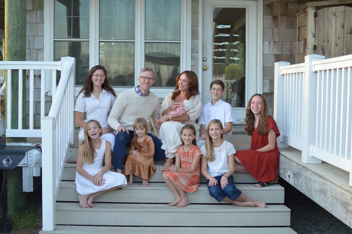 Mr. and Mrs. Collins with their eight children. (Courtesy of Adele Collins)