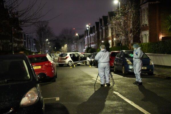 Forensics teams at the scene of an acid attack in Lessar Avenue, near Clapham Common in south London on Feb. 1, 2024. (PA)