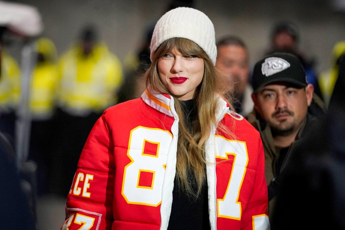 Taylor Swift wears a Kansas City Chiefs jacket featuring Travis Kelce's jersey number as she arrives at an NFL game between the Chiefs and the Miami Dolphins in Kansas City, Mo., on Jan. 13, 2024. (Ed Zurga/AP Photo)