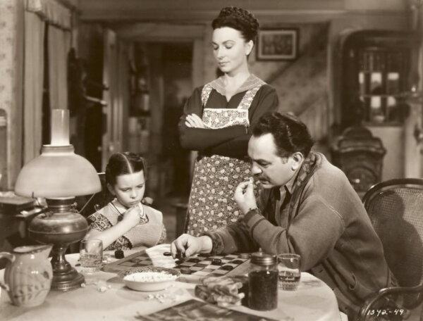 (L–R) Selma Jacobson (Margaret O’Brien), Bruna Jacobson (Agnes Moorhead), and Martinius Jacobson (Edward G. Robinson), in “Our Vines Have Tender Grapes.” (Loew's Inc.)