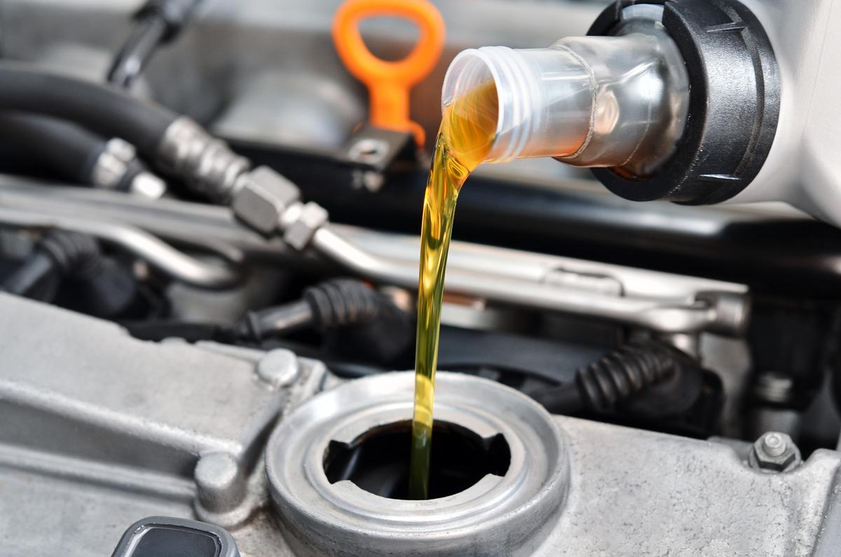 Motor oil is one of the most important automotive fluids to keep full, but take care to never overfill. Change it every 5,000 to 7,500 miles or annually. (Ensuper/Shutterstock)