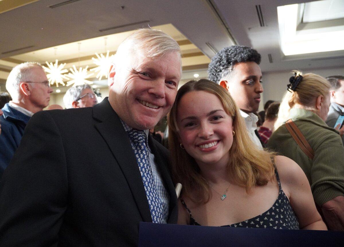 Margot O'Brien (R) and her father, Michael O'Brien, from Loudoun County, at a rally of Republican presidential candidate Nikki Haley in Falls Church, Va., on Feb. 29, 2024. (Terri Wu/The Epoch Times)