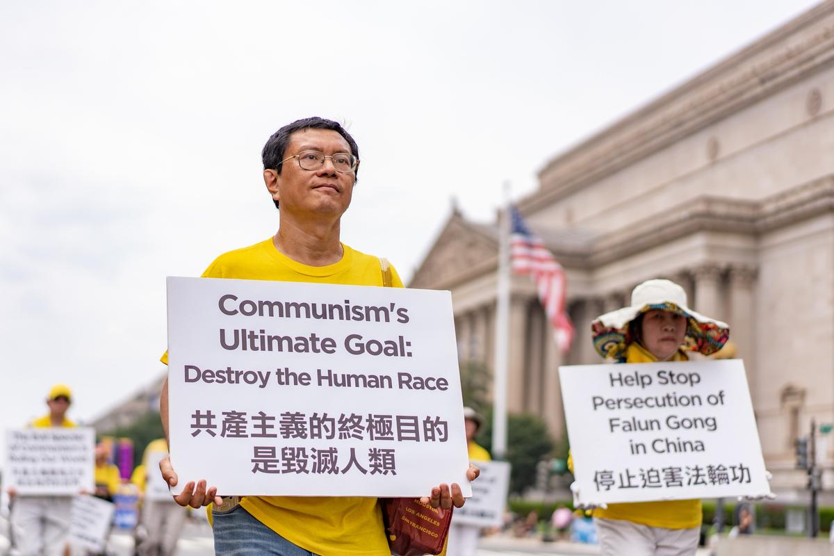 Falun Gong practitioners take part in a parade in Washington, D.C., to mark the 24th anniversary of the persecution of the spiritual discipline in China by the Chinese Communist Party on July 20, 2023. (Samira Bouaou/The Epoch Times)