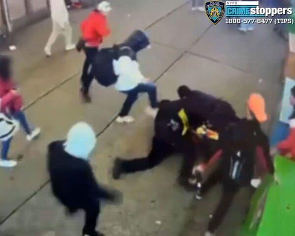 Video still shows a group of illegal immigrants attacking two NYPD officers outside a shelter in New York, on Jan. 27, 2024. (New York Police Department)