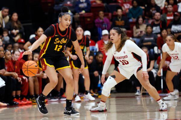 Southern California guard JuJu Watkins (12) brings the ball up court against Stanford guard Talana Lepolo (10) in the second half of an NCAA college basketball game in Stanford, Calif., on Feb. 2, 2024. (Josie Lepe/AP Photo)