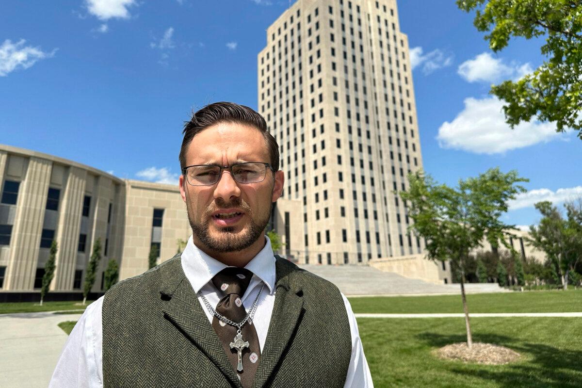 Burleigh County Auditor Mark Splonskowski poses in front of the state Capitol in Bismarck, N.D., on July 7, 2023. (AP Photo/Jack Dura, File)