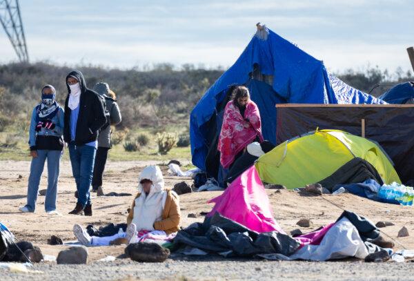 Border Patrol Morale Hits ‘All-Time Low’ 3 Illegal immigrants station themselves at an encampment after crossing the United States border in Jacumba, Calif., on Feb. 3, 2024. (John Fredricks/The Epoch Times)