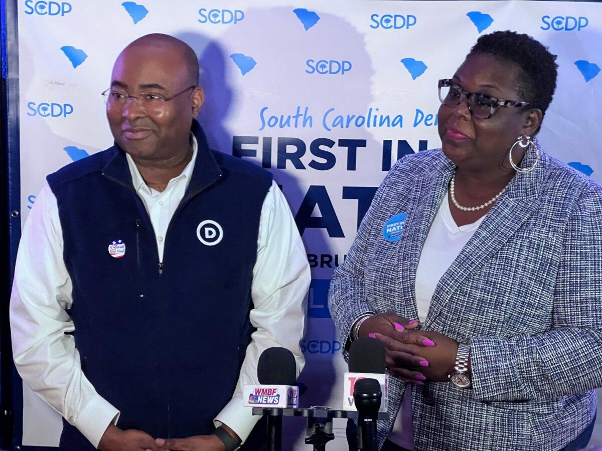 DNC Chair Jamie Harrison (L) and South Carolina Democratic Party Chair Christale Spain listen to a reporter's question in Columbia, S.C., on Feb. 3, 2024. (Lawrence Wilson/The Epoch Times)