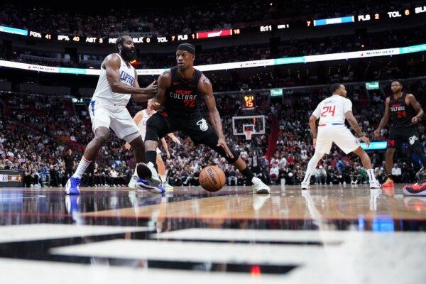 Jimmy Butler (22) of the Miami Heat dribbles the ball against James Harden (1) of the LA Clippers during the first quarter in Miami on Feb. 4, 2024. (Rich Storry/Getty Images)
