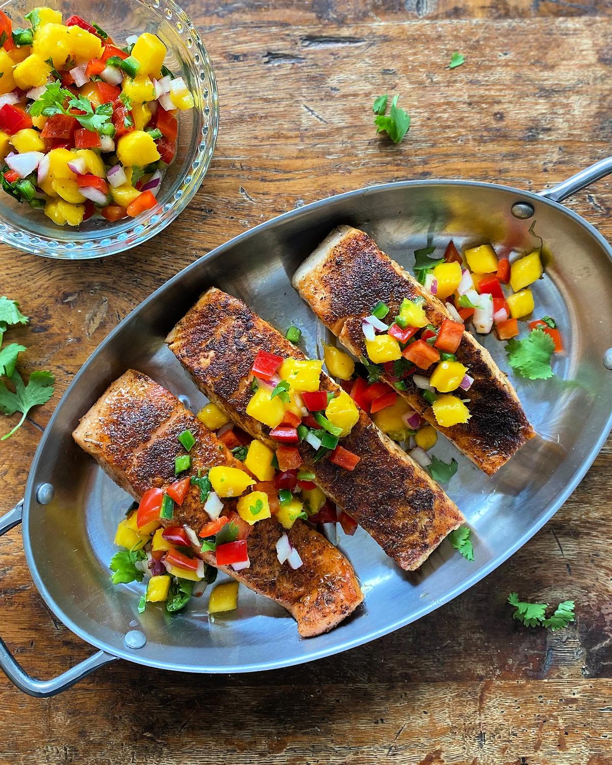 A juicy mango salsa cools and complements the savory, spicy rub for a perfectly balanced bite. (Lynda Balslev for Tastefood)