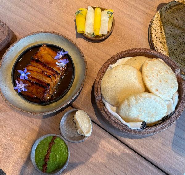Glazed pork belly with arepas served at Mérito in the trendy Barranco neighborhood of Lima. (Colleen Thomas/TNS)
