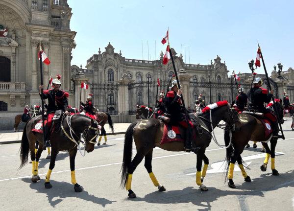 Peruvian military soldiers on horses put on a show in front of the presidential palace at Plaza de Armas. (Colleen Thomas/TNS)