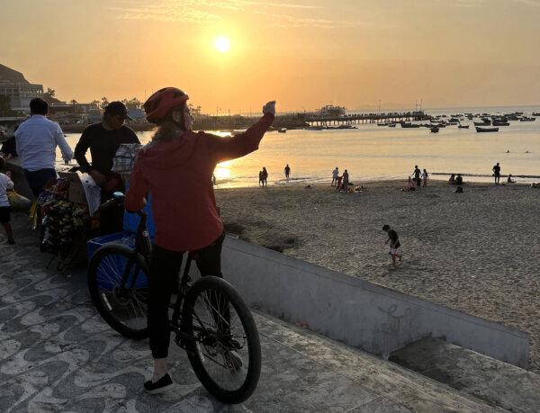 A bike tour stops for a view along the oceanfront in the Barranco district. (Colleen Thomas/TNS)