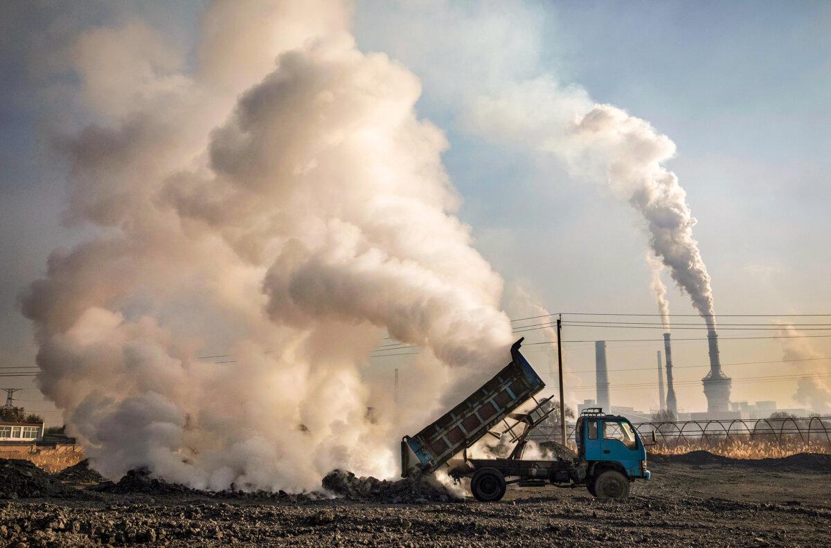 Waste coal is unloaded near an unauthorized steel factory in Inner Mongolia, China, on Nov. 3, 2016. (Kevin Frayer/Getty Images)