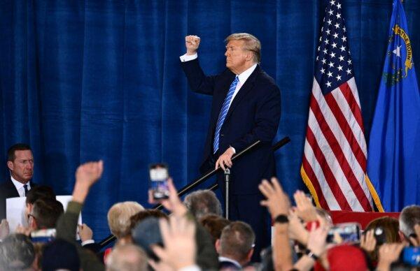 Former President Donald Trump raises his fist as he leaves after speaking at a Commit to Caucus Rally in Las Vegas, on Jan. 27, 2024. (Patrick T. Fallon/AFP via Getty Images)