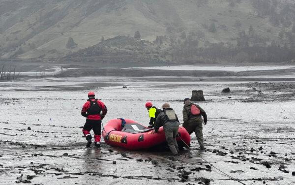 Volunteers attempt to rescue two deer that were stuck in mud in Copco Lake, Calif., on Jan. 27, 2024, after officials began draining the lake as part of a process to remove two dams. The two deer were later euthanized by state fish and wildlife personnel after rescue attempts failed. (Courtesy of Hornbrook Fire Protection District)