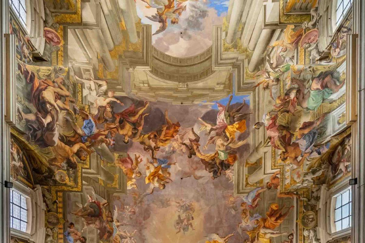Detail of “Triumph of Sant'Ignazio" by Andrea Pozzo, in the Church of St. Ignatius of Loyola, showing America on the left and Africa on the right. (<a href="https://en.wikipedia.org/wiki/File:Iglesia_de_San_Ignacio_de_Loyola,_Roma,_Italia,_2022-09-15,_DD_27-29_HDR.jpg">Diego Delso</a>, delso.photo, License CC-BY-SA)