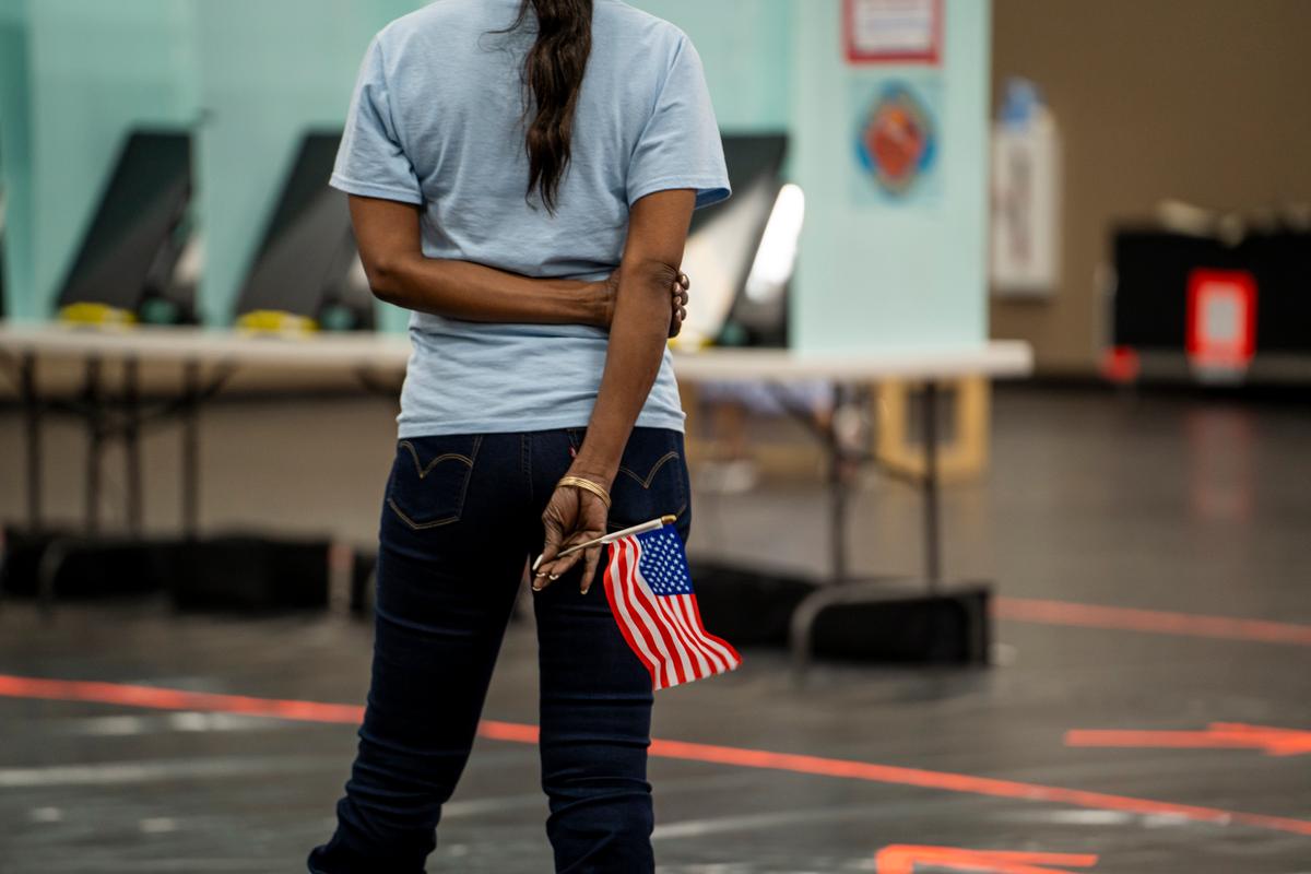 Poll workers direct voters at the Desert Breeze Community Center in Spring Valley, Nev., on Feb. 6, 2024. (Madalina Vasiliu/The Epoch Times)