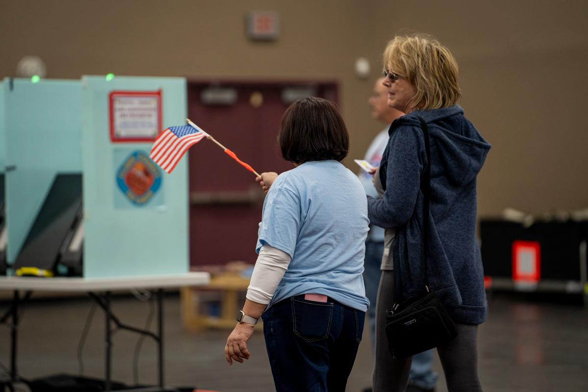 Poll workers direct voters at the Desert Breeze Community Center in Spring Valley, Nev., on Feb. 6, 2024. (Madalina Vasiliu/The Epoch Times)