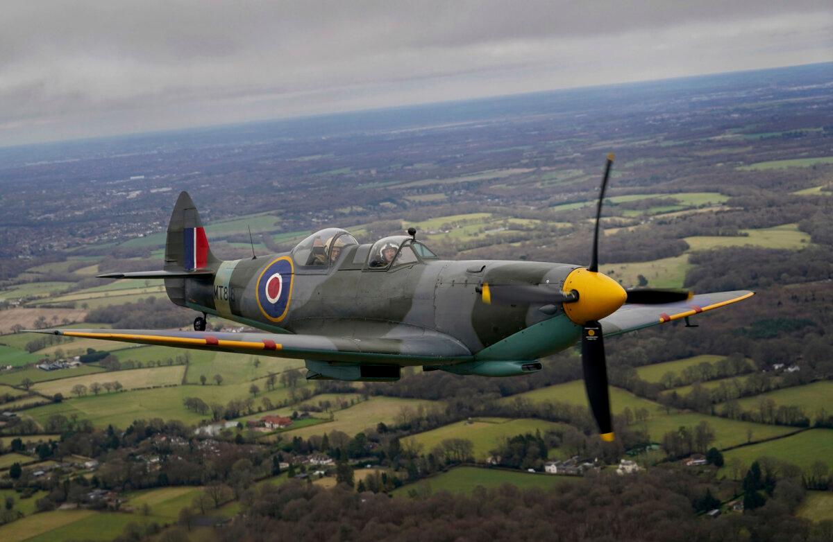 102-year-old Jack Hemmings AFC flies a Spitfire plane to mark 80th anniversary of the military charity Mission Aviation Fellowship (MAF) after taking off at the iconic Heritage Hanger at London Biggin Hill, England, on Feb. 5, 2024. (Gareth Fuller/PA via AP)