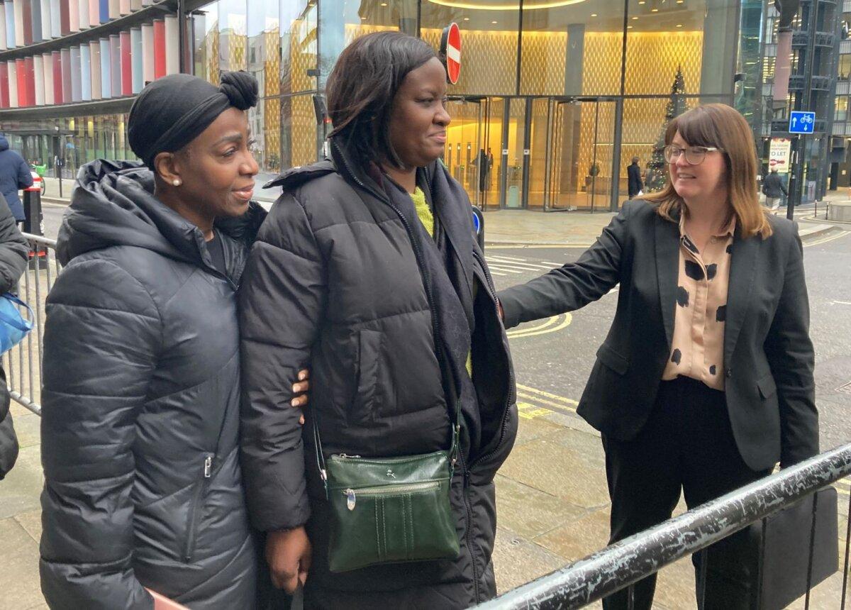 Tracey-Ann Henry (C), whose sister Tanysha Ofori-Akuffo was one of four people murdered by Joshua Jacques, appears outside the Old Bailey in London on Dec. 21, 2023. (PA)