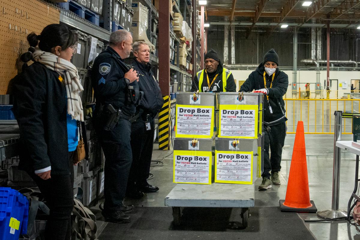 Election workers move boxes with ballots after the primary election at the Clark County Election Department in North Las Vegas, Nev., on Feb. 6, 2024. (Madalina Vasiliu/The Epoch Times)