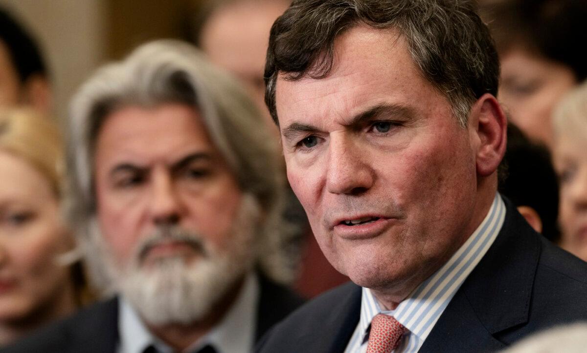 Minister of Transport Pablo Rodriguez looks on as Minister of Public Safety, Democratic Institutions and Intergovernmental Affairs Dominic LeBlanc speaks about auto theft in Ottawa on Feb. 7, 2024. (The Canadian Press/Adrian Wyld)