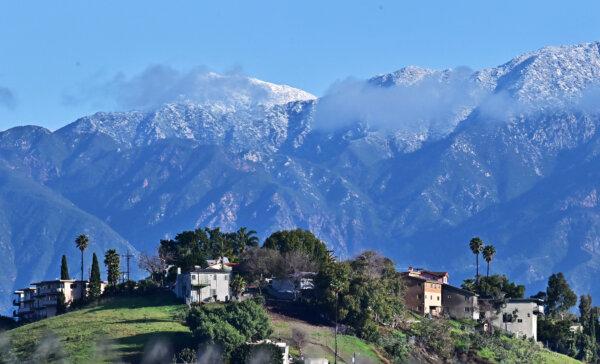 Clouds hover around the lightly snow-capped San Gabriel Mountains in Los Angeles on Feb. 7, 2024. (Frederic J. Brown/AFP via Getty Images)