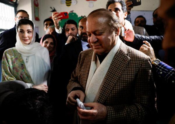 Former Prime Minister Nawaz Sharif smiles on the day he casts his vote at a polling station during the general election in Lahore, Pakistan, on Feb. 8, 2024. (Navesh Chitrakar/Reuters)